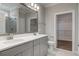 Bathroom featuring a double vanity with a large mirror and tile flooring at 149 Seaton St, Summerville, SC 29486