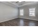 Bedroom with hardwood floors, crown molding, and natural light from the windows at 149 Seaton St, Summerville, SC 29486