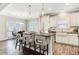 Modern kitchen boasts a large island, stainless steel appliances, and pendant lighting at 149 Seaton St, Summerville, SC 29486
