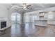 Open-concept living room featuring a fireplace, coffered ceiling, and hardwood floors at 149 Seaton St, Summerville, SC 29486