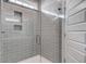 Tiled shower with a glass door, built-in niche, and modern fixtures at 149 Seaton St, Summerville, SC 29486