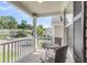 Inviting outdoor balcony area, perfect for enjoying morning coffee or relaxing in the evening, with table and chairs at 153 Instructor Ct, Ladson, SC 29456