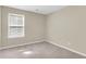 Clean, sunlit bedroom featuring neutral walls and plush carpeting, offering a blank canvas for personalization at 153 Instructor Ct, Ladson, SC 29456