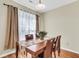 Cozy dining area with wood table, seating for four, and natural light at 153 Instructor Ct, Ladson, SC 29456
