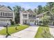 Charming two-story home with a well-maintained lawn, attached garage, and inviting curb appeal at 153 Instructor Ct, Ladson, SC 29456
