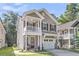 Charming two-story home with a welcoming front porch and a well-maintained lawn at 153 Instructor Ct, Ladson, SC 29456