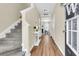 View of the foyer showing the wood floors, staircase, and entryway at 153 Instructor Ct, Ladson, SC 29456