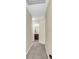 Inviting hallway leading to a well-lit bathroom featuring modern fixtures and a classic vanity at 153 Instructor Ct, Ladson, SC 29456