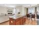 Open-concept living room and kitchen featuring hardwood floors and modern decor at 153 Instructor Ct, Ladson, SC 29456