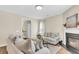 Bright and airy living room with a fireplace and comfortable seating at 153 Instructor Ct, Ladson, SC 29456