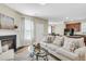 Cozy living room featuring a fireplace, plush seating, and an open floor plan at 153 Instructor Ct, Ladson, SC 29456