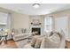 Comfortable living room with a fireplace, neutral furniture, and natural light at 153 Instructor Ct, Ladson, SC 29456