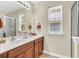 Bathroom featuring double sink vanity, large mirror, and neutral walls at 153 Instructor Ct, Ladson, SC 29456