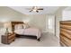 Bright main bedroom with hardwood furniture, neutral walls and soft carpeting at 153 Instructor Ct, Ladson, SC 29456