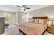 Spacious main bedroom with natural light, a ceiling fan, and neutral carpeting at 153 Instructor Ct, Ladson, SC 29456