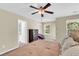Main bedroom featuring ceiling fan, plush carpeting and ensuite bathroom access at 153 Instructor Ct, Ladson, SC 29456