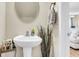 Stylish powder room with pedestal sink and decorative accents at 153 Instructor Ct, Ladson, SC 29456