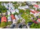 Aerial view of a neighborhood showcasing colorful rooftops and mature trees at 176 Smith St, Charleston, SC 29403