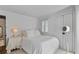 Cozy bedroom featuring neutral decor, shuttered windows, and a soft, comfortable bed at 176 Smith St, Charleston, SC 29403