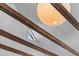 Striking ceiling with wooden beams and modern light fixture at 176 Smith St, Charleston, SC 29403