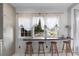 Cozy dining area with a bar counter, complemented by a view of the outdoor landscape at 176 Smith St, Charleston, SC 29403