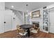 Cozy dining area with a decorative fireplace, staircase and hardwood floors, perfect for everyday and entertaining at 176 Smith St, Charleston, SC 29403