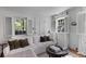 Comfortable living room with white sofa, hardwood floors, and natural light streaming through windows at 176 Smith St, Charleston, SC 29403