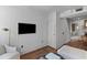 Cozy room with hardwood flooring and a wall-mounted television, perfect for relaxing and entertaining at 176 Smith St, Charleston, SC 29403