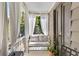 Cozy porch with white bench seating and light-filtering curtains at 176 Smith St, Charleston, SC 29403