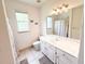 Well-lit bathroom featuring a white vanity, walk-in shower, and decorative wall art for a charming touch at 1804 Bass Rd, Moncks Corner, SC 29461