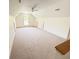 Large bonus room with neutral carpeting, a vaulted ceiling, and natural light, perfect for a flexible living space at 1804 Bass Rd, Moncks Corner, SC 29461