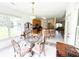 Inviting breakfast nook with glass table, chandelier, and access to the kitchen area at 1804 Bass Rd, Moncks Corner, SC 29461