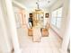 Elegant dining room with tiled floor, chandelier, and glass-topped table with seating at 1804 Bass Rd, Moncks Corner, SC 29461