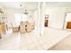 Spacious dining room with tile flooring, elegant chandelier, and ample natural light, perfect for Gathering gatherings at 1804 Bass Rd, Moncks Corner, SC 29461