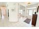 Inviting foyer with white tile flooring, decorative pillars, and plenty of natural light at 1804 Bass Rd, Moncks Corner, SC 29461