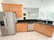 The kitchen features stainless steel appliances, granite counters, wooden cabinets, and easy access to other rooms at 1804 Bass Rd, Moncks Corner, SC 29461