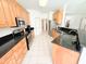 The kitchen offers granite countertops, wooden cabinets, stainless steel appliances, and tiled floors at 1804 Bass Rd, Moncks Corner, SC 29461