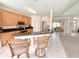 Well-equipped kitchen with breakfast bar, wood cabinets, granite countertops, and stainless steel appliances at 1804 Bass Rd, Moncks Corner, SC 29461