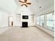 Bright living room featuring vaulted ceiling, fireplace, built-ins, and ample natural light at 1804 Bass Rd, Moncks Corner, SC 29461