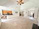 Bright living room featuring vaulted ceiling, tile floors, and open access to the kitchen, perfect for entertaining at 1804 Bass Rd, Moncks Corner, SC 29461
