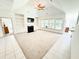 Light-filled living room with fireplace, built-ins, neutral carpet, and many windows at 1804 Bass Rd, Moncks Corner, SC 29461