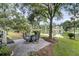 Backyard features a patio set on a patio overlooking a tranquil lake, perfect for outdoor living at 1809 Two Cedar Way, Mount Pleasant, SC 29466