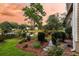 Well-maintained backyard showcasing lush landscaping and a tranquil lake view, creating a peaceful outdoor retreat at 1809 Two Cedar Way, Mount Pleasant, SC 29466