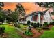 Charming home with a screened-in porch and beautiful landscaping, nestled beside a serene lake at 1809 Two Cedar Way, Mount Pleasant, SC 29466