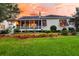 Well-maintained home with a screened porch, lush landscaping, and manicured lawn in a serene neighborhood at 1809 Two Cedar Way, Mount Pleasant, SC 29466