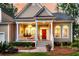 Charming front porch with white columns and a bright red door, creating a warm welcome at 1809 Two Cedar Way, Mount Pleasant, SC 29466