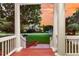 Inviting front porch framed by classic columns, offering serene neighborhood views at 1809 Two Cedar Way, Mount Pleasant, SC 29466