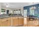 Open kitchen area with a stove top, adjacent to the dining area at 1809 Two Cedar Way, Mount Pleasant, SC 29466