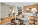 Spacious living room featuring hardwood floors and elegant décor, perfect for entertaining guests at 1809 Two Cedar Way, Mount Pleasant, SC 29466