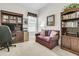 Cozy home office with a comfortable sofa, bookshelves, and a traditional wooden desk at 1809 Two Cedar Way, Mount Pleasant, SC 29466